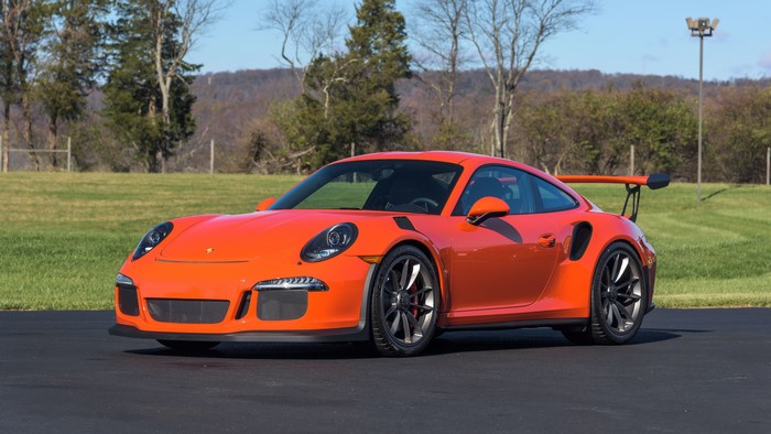 Orange Porsche 911 GT3 RS on asphalt