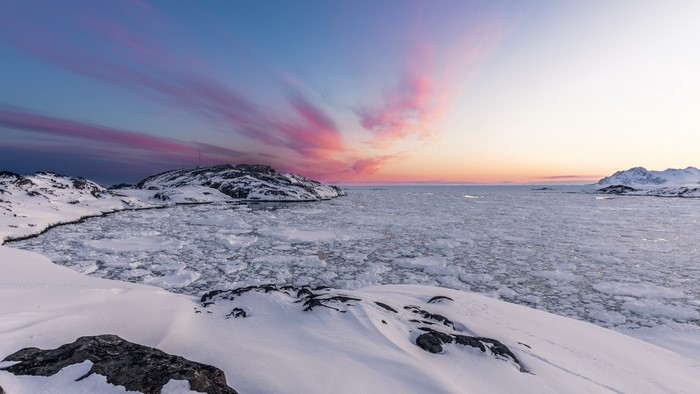Ice floes in the sea at sunset in Greenland