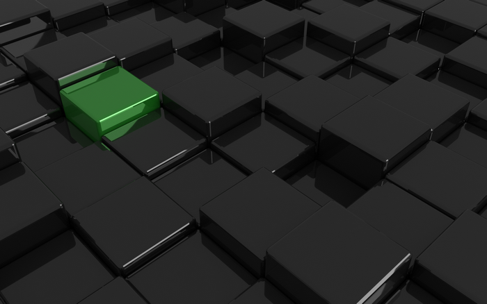 Green cube among black cubes