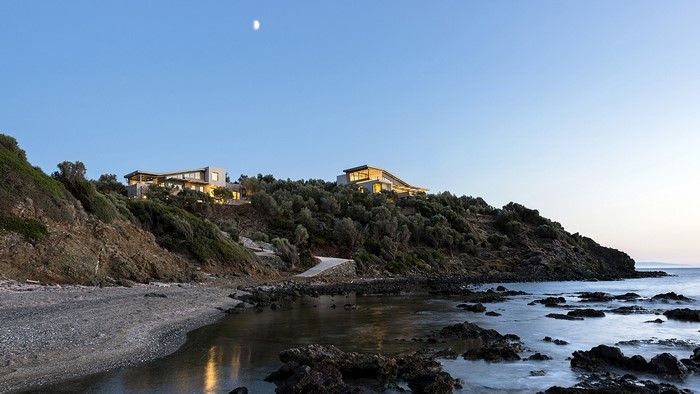 Modern luxury houses on a hillside overlooking the sea