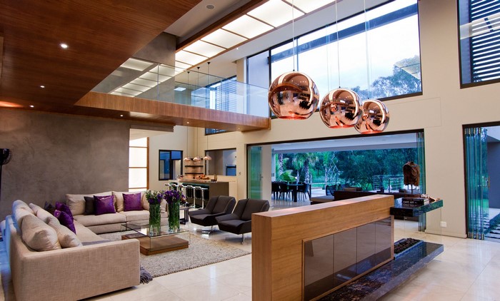 Modern living room with high ceilings and large windows