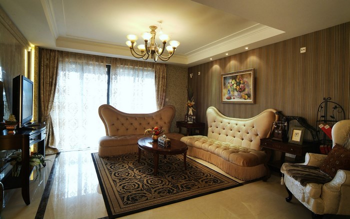 Living room with tufted sofas and ornate rug