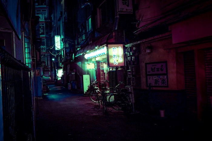 Night alley in Japan with neon lights