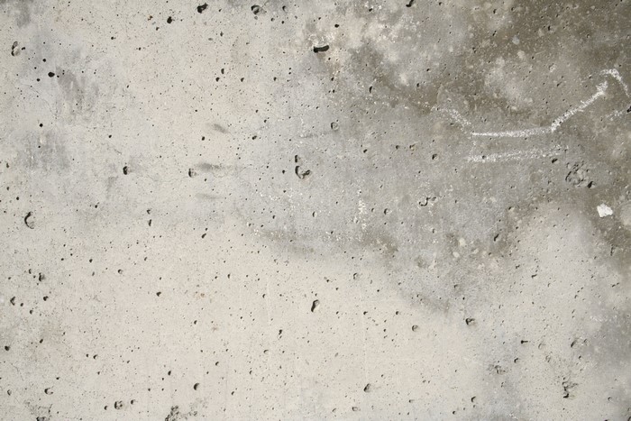 Concrete texture with small holes and chalk drawing