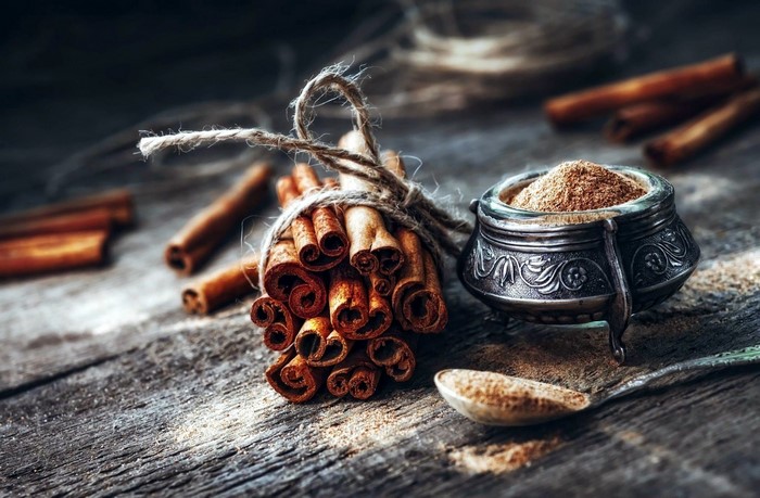 Rustic cinnamon sticks and powder still life