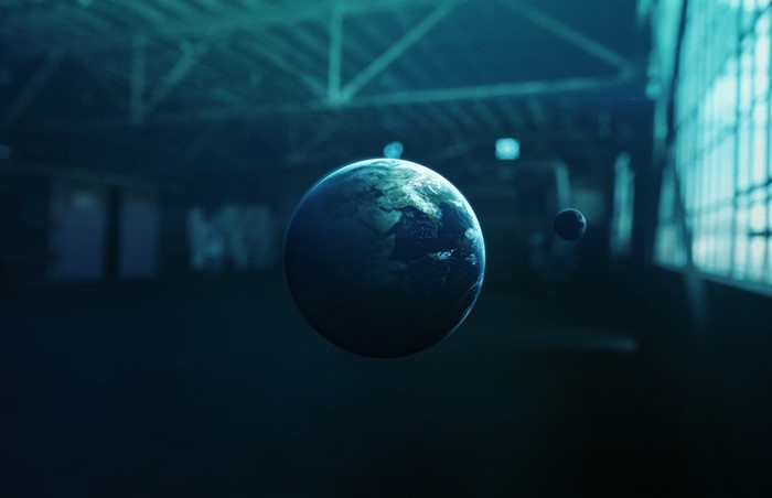 Earth and Moon in an industrial space by Vadim Sadovski
