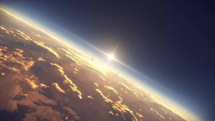 Sunrise over Earth's atmosphere with clouds