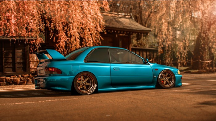 Blue Subaru Impreza WRX STI with colored wheels