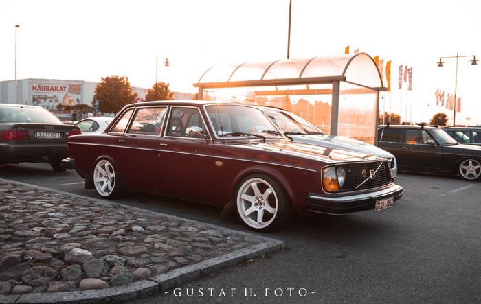 Maroon Volvo 240 Sedan in Sweden