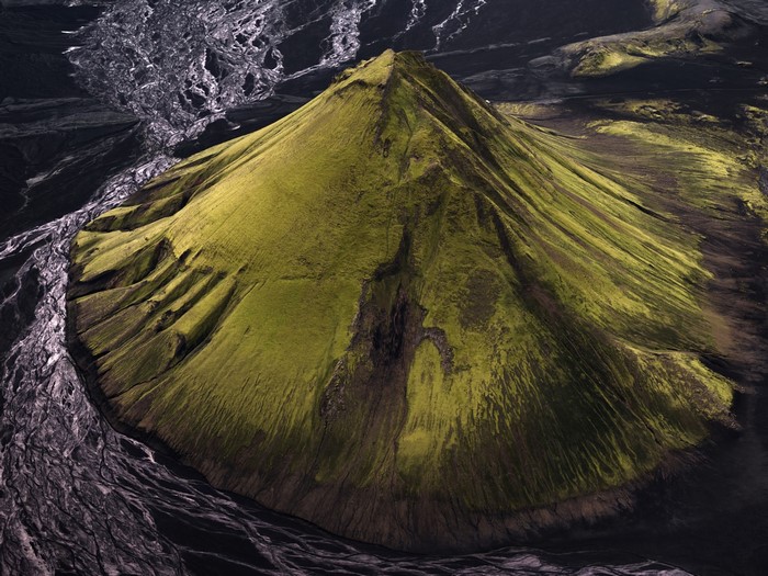 Aerial view of a moss-covered stratovolcano in Iceland