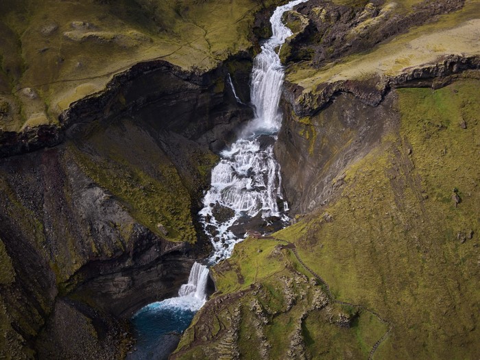 Aerial view of a cascading waterfall in Iceland