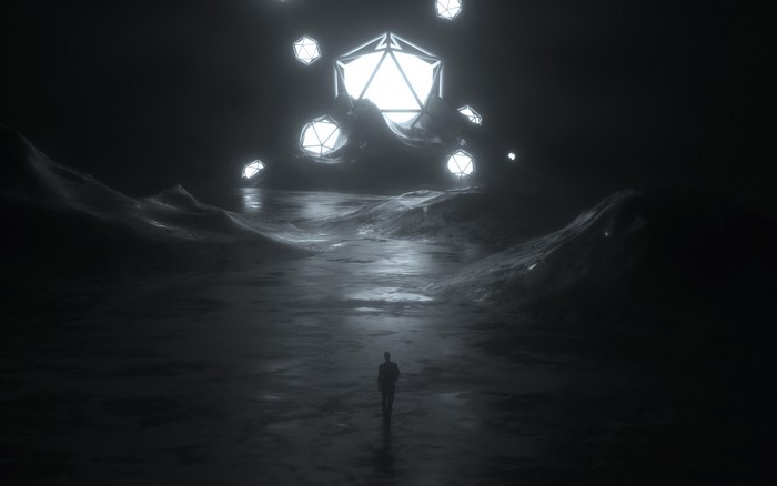 Man walking towards glowing geometric shapes