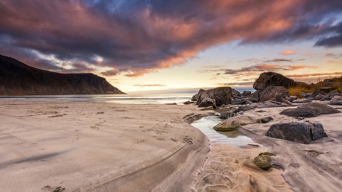Beach with Mountain and Dramatic Clouds at Sunset