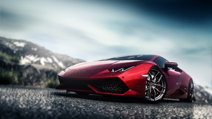 Red Lamborghini Huracan on a wet road