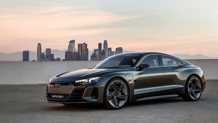 Audi e-tron GT concept car in front of a cityscape