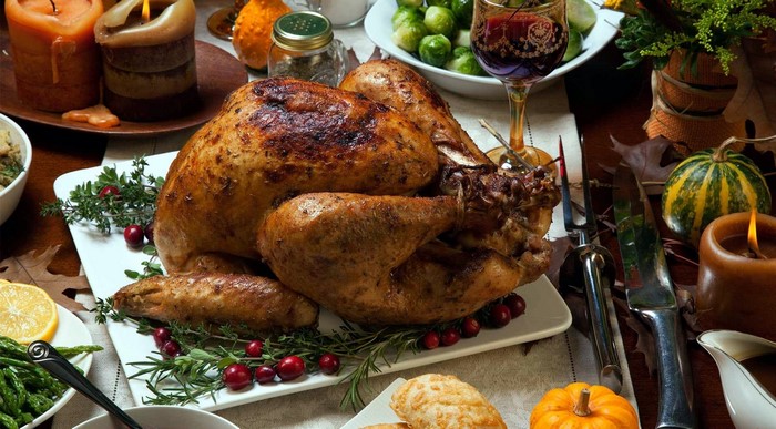 Roasted turkey with cranberries, rosemary, and side dishes