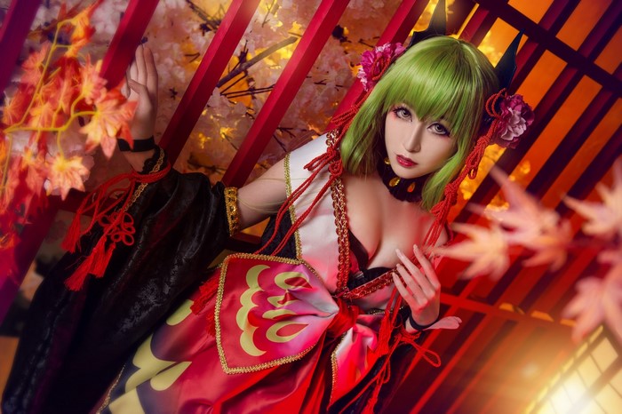 Woman with green hair in cosplay