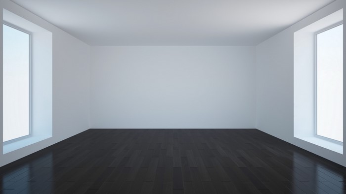 Empty white room with dark wooden floor and large windows