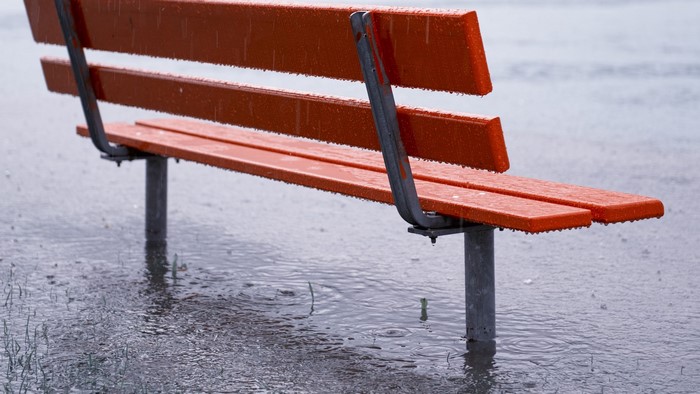 Orange bench in the rain