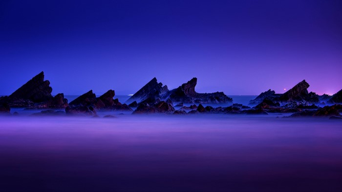 4K rocky coast at night with mist