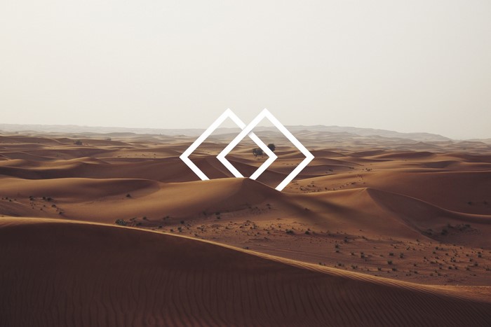Desert dunes with abstract geometric overlay