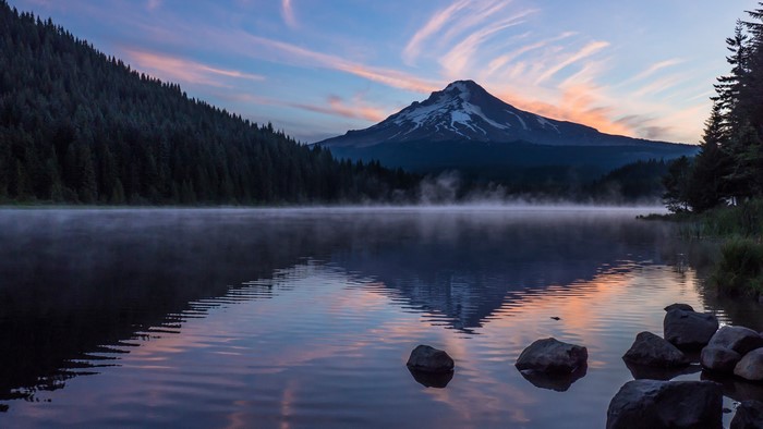 Mountain lake reflection at sunrise