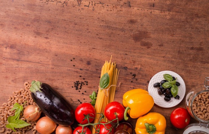 Ingredients for Italian food on a wooden table