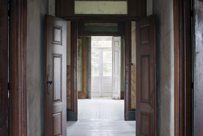 Interior of an old house with open doors