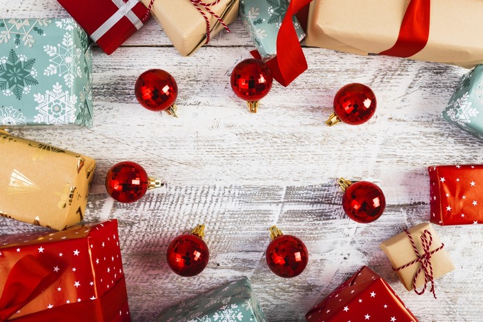 Christmas presents and ornaments on a wooden table