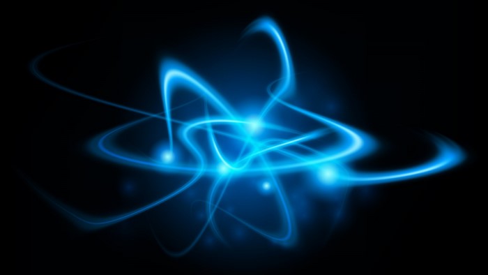 Abstract blue atomic orbits on black background