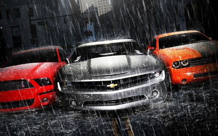 Three muscle cars in the rain: Chevrolet Camaro, Ford Mustang, Dodge Challenger