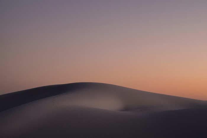 Desert sand dunes at sunset