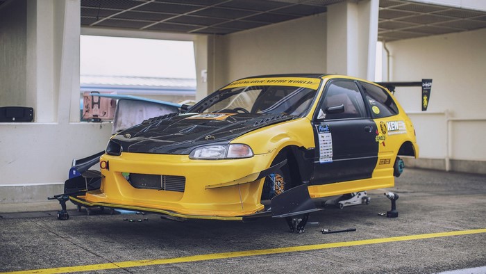 Yellow and black Honda Civic EG race car