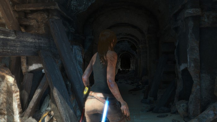 Lara Croft from Rise of the Tomb Raider in a tomb