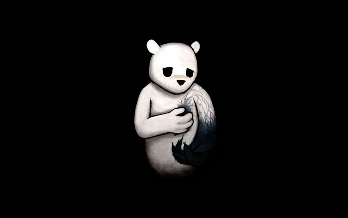 Sad white bear with dark tree-like pattern on chest