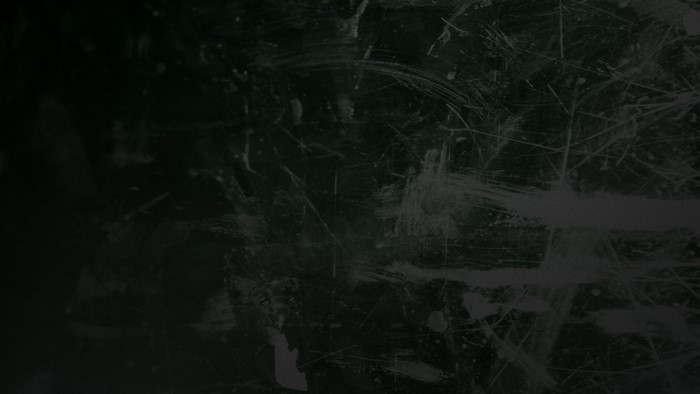 Dark background with scratches
