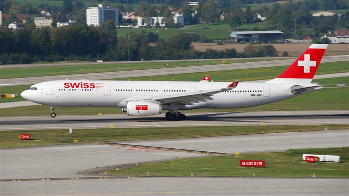 Swiss passenger airplane on runway