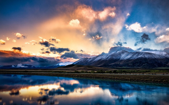 Mountain range reflected in a lake at sunset