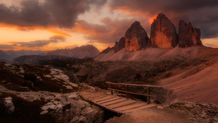 4K Dolomites mountains landscape at dusk with bridge