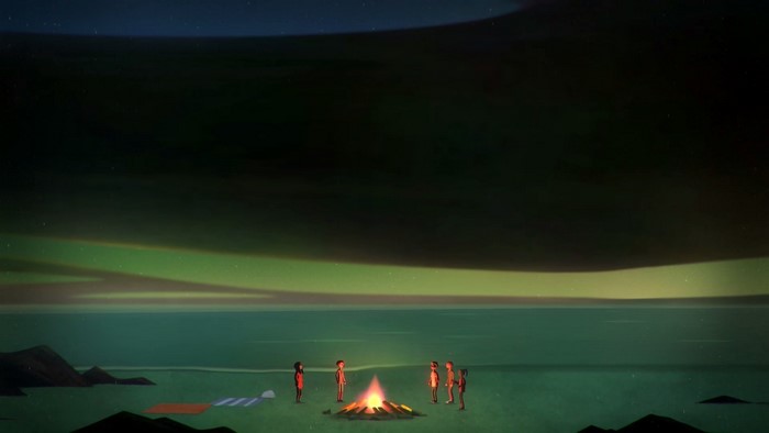 Group of people around a campfire under the aurora borealis