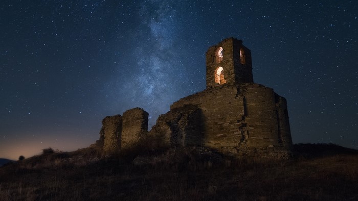 Ruins under the starry night sky