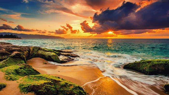 4K Sunset Over Ocean with Rocky Beach