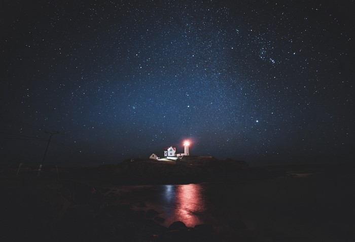 Lighthouse on Cape Neddick under a starry night sky