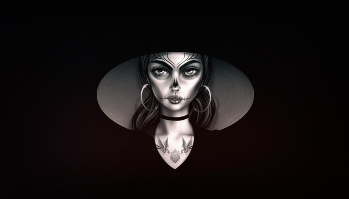 Woman with Dia de los Muertos makeup and tattoos