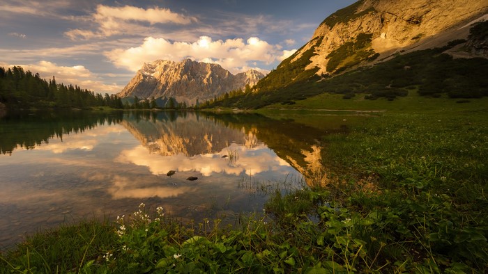 Mountains reflected in a lake at sunset