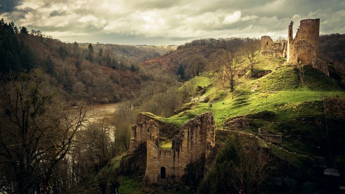 Castle ruins on a grassy hill in France