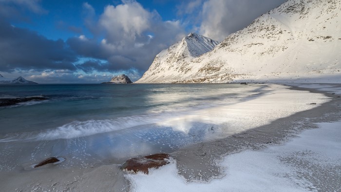 Snowy mountains and beach in Lofoten, Norway