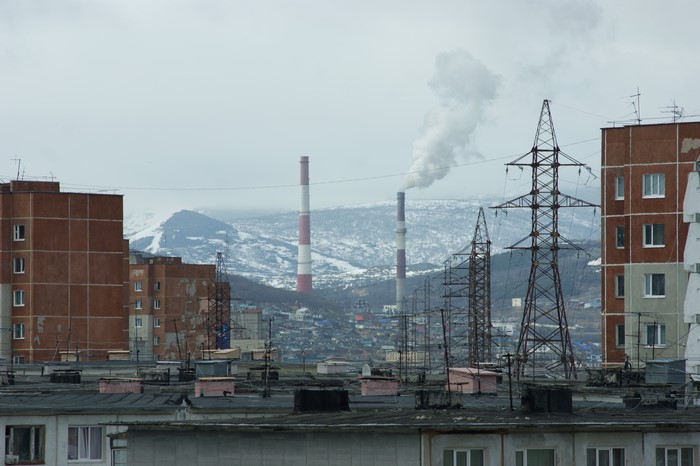 4K Russian urban landscape with power lines and smokestacks in Magadan