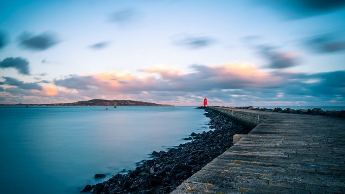Red lighthouse on a pier in Dublin, Ireland