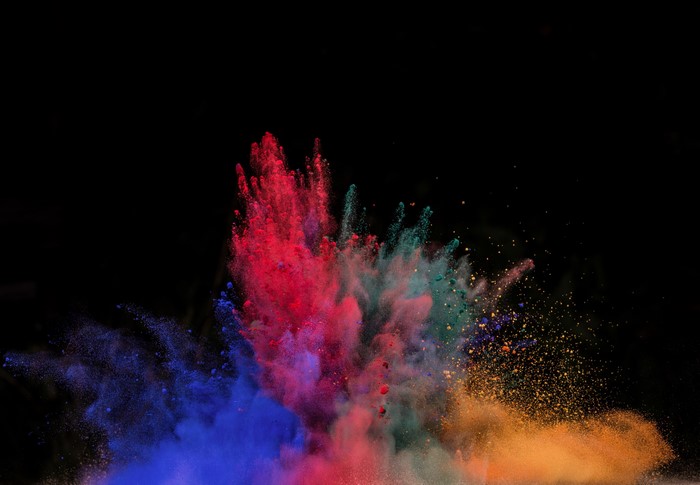 Colorful powder explosion on black background